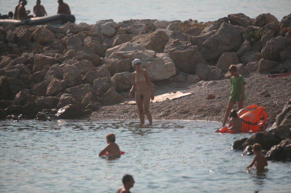 FKK cove pyramid in waters - Blending in with the crowd of nudists