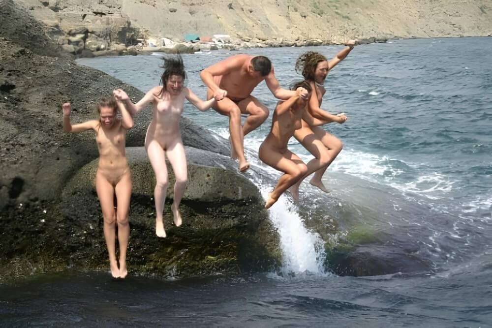 Mens and girls nudists on a beach - Nudism and naturism bring you closer to nature