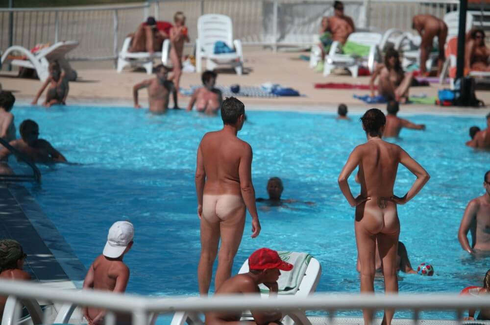 Pool-Shore Group Exercise - Nudism helps strengthen friendships