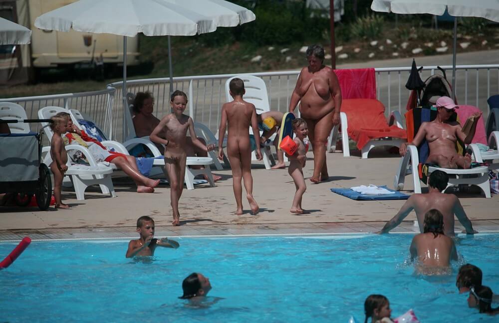 Naturist Afternoon Pool Games pics - Public nudism