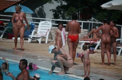 Enjoying The Sunny Pool gallery - Nudity in naturism is not usually an end in itself