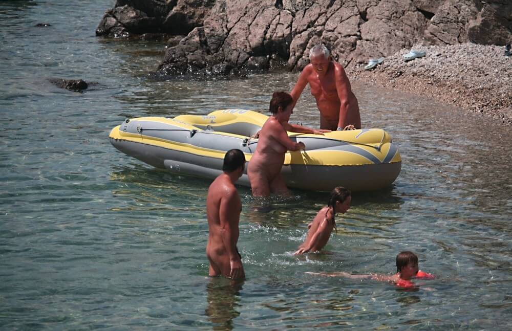 Lone Nudist in Yellow Boat photos - Joy and pleasure are part of the nudist experience
