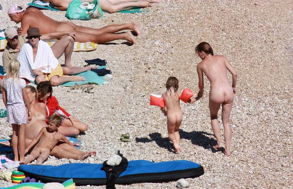 Orange Floaty Safety First Naturist pics - A love of the sun and fresh air are important values for those who practice naturism and nudism