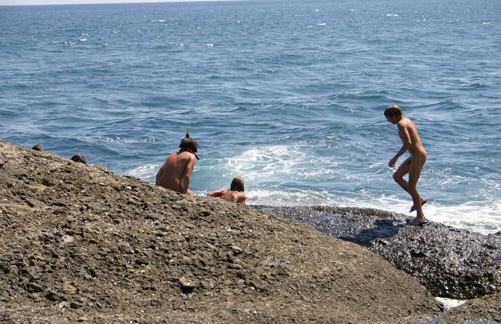 Leaning Against Hit Rocks pics - Family naturism in European countries